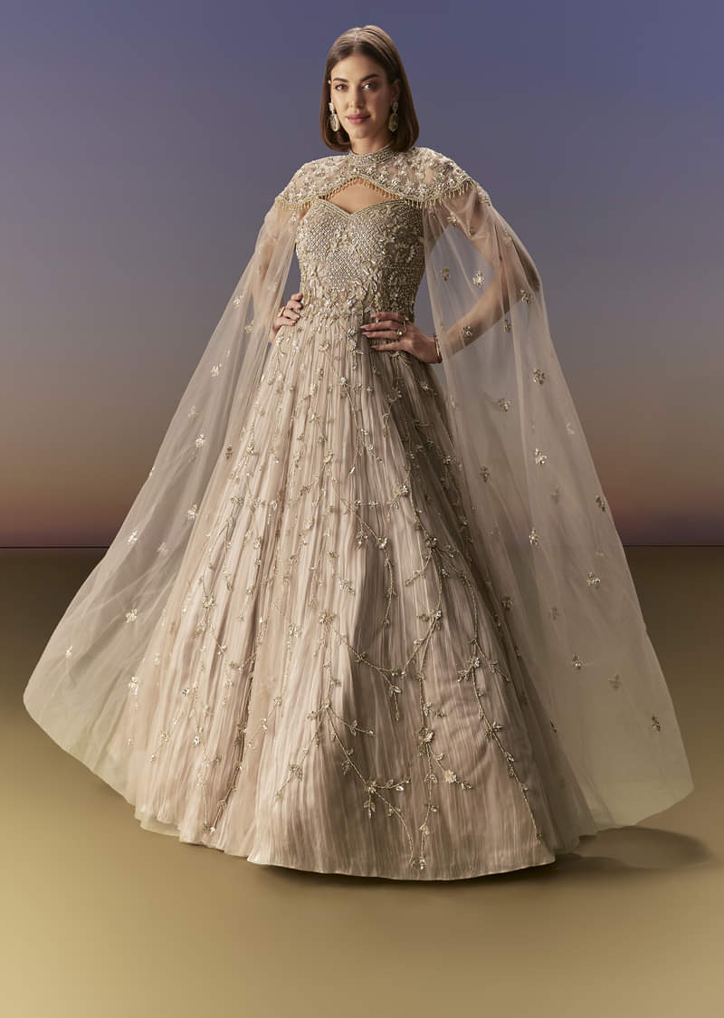 Beige Gown With Shoulder Cape And Rich Vertical Embroidery