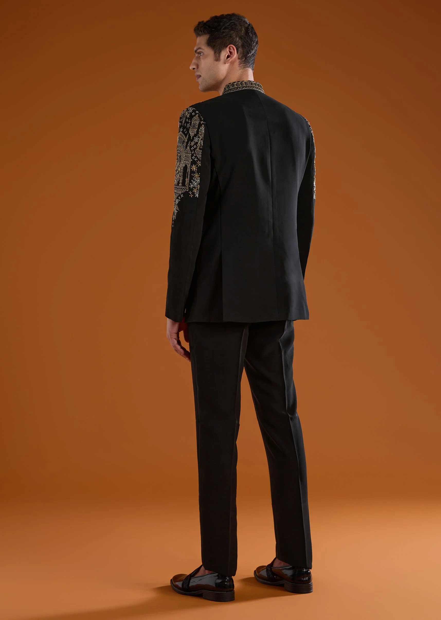 Bold Festive Couple Set – Black Silk Palazzo Suit With Zari Thread And Sequins Work For Her And Black Suiting Jodhpuri Pant Set With Embroidery For Him - Image 9