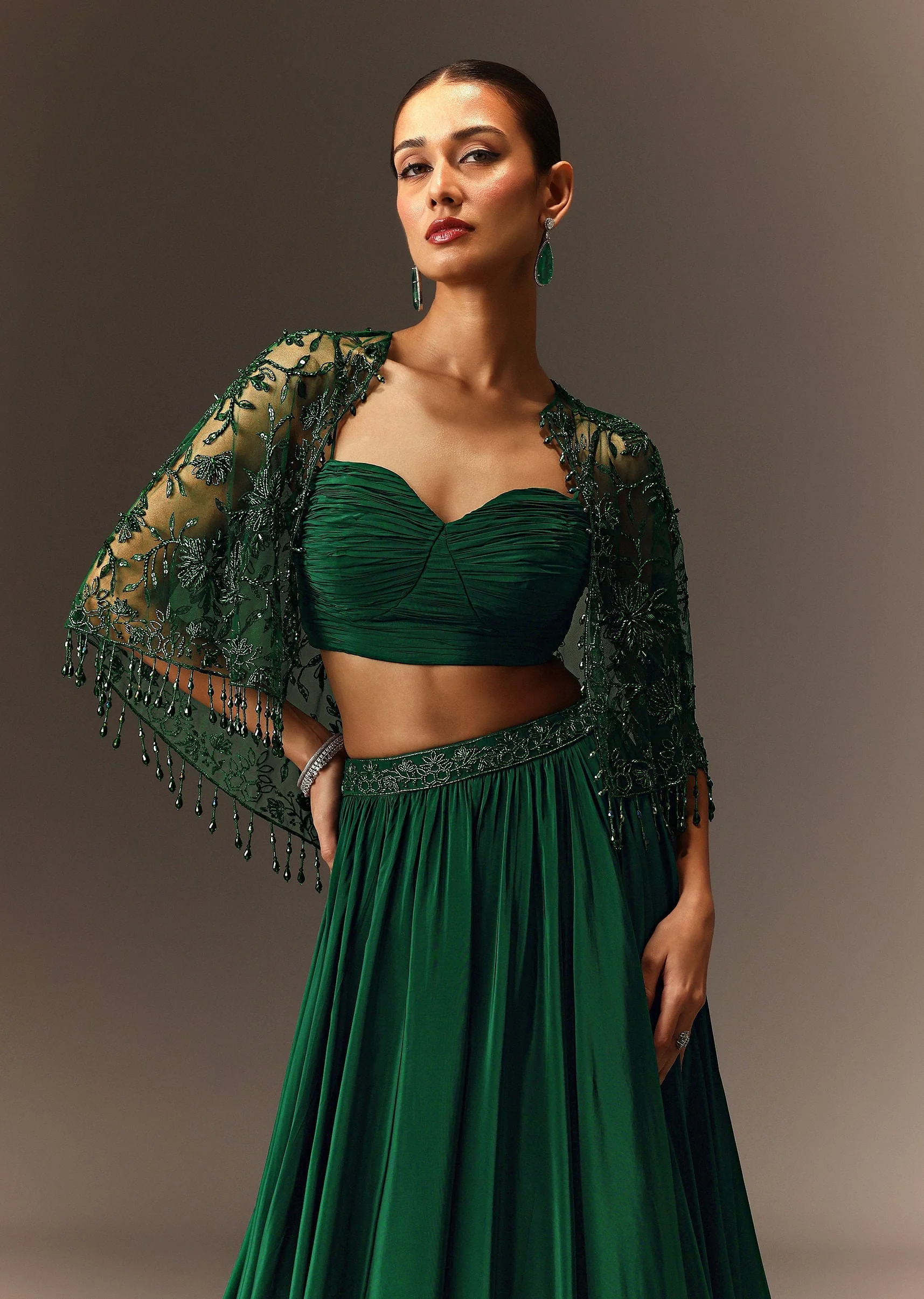 Bottle Green Tiered Lehenga With Net Cape - Image 2
