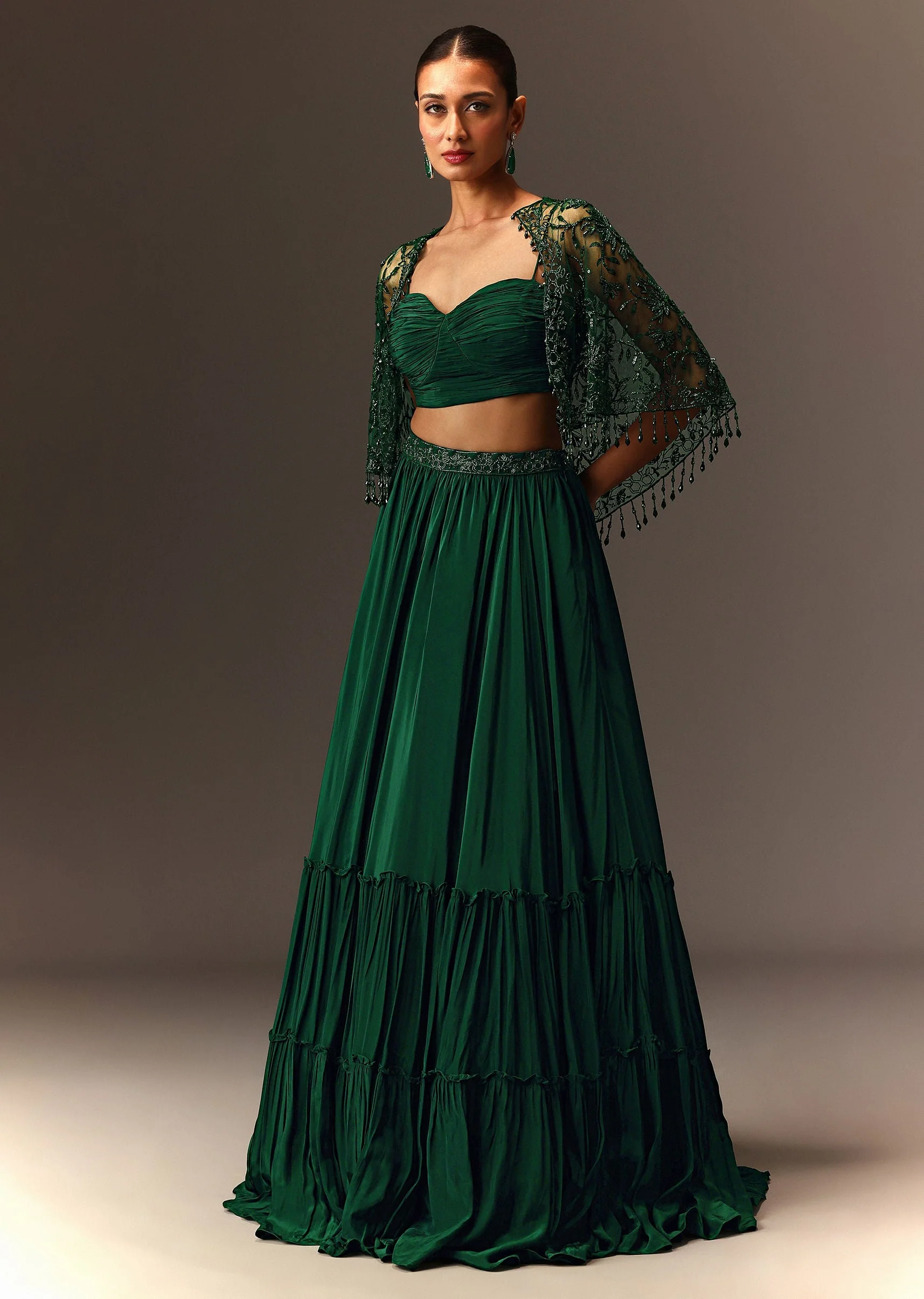 Bottle Green Tiered Lehenga With Net Cape - Image 3
