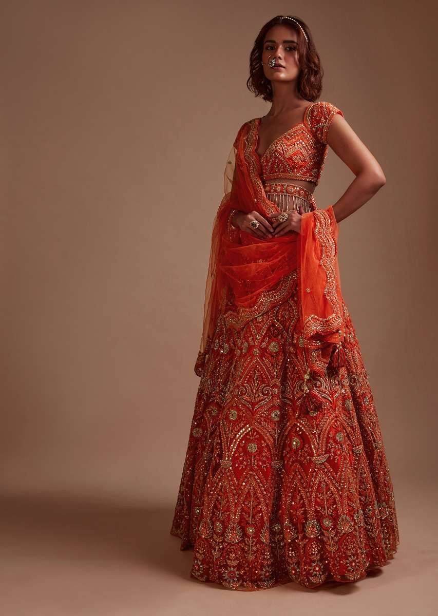 Coral Orange Lehenga Choli In Net With Mirror And Sequins Embroidered Floral And Mughal Embroidery Along With Belt Detailing - Image 3