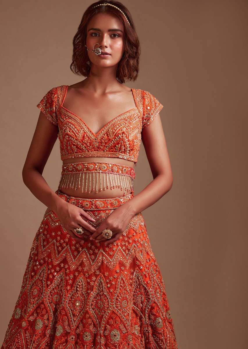 Coral Orange Lehenga Choli In Net With Mirror And Sequins Embroidered Floral And Mughal Embroidery Along With Belt Detailing - Image 4