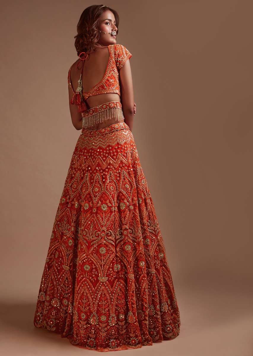 Coral Orange Lehenga Choli In Net With Mirror And Sequins Embroidered Floral And Mughal Embroidery Along With Belt Detailing - Image 5