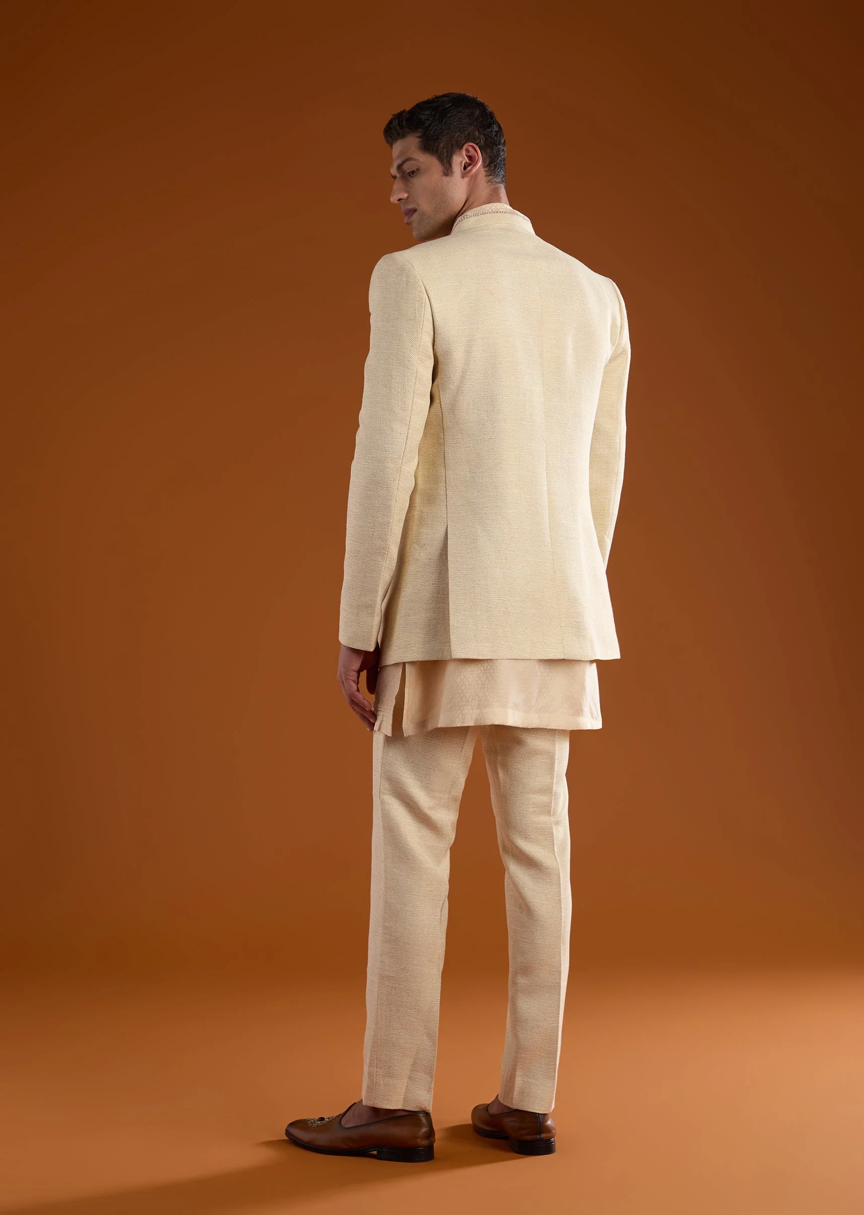 Gold Celebration Duo – Jumpsuit With Jacket For Her And Embellished Jodhpuri Kurta Set For Him - Image 9