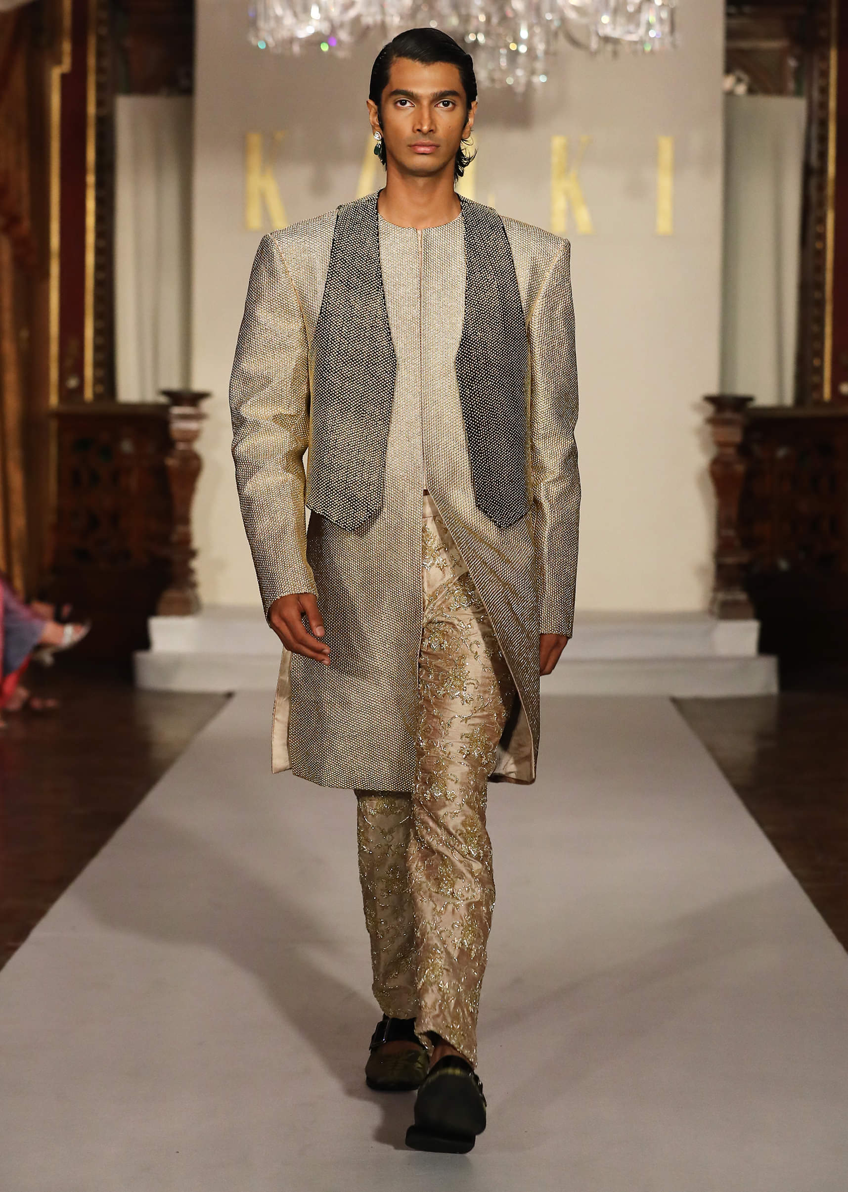 Gold Metallic Hand Embroidered Bridal Gown With Asymmetric Fall