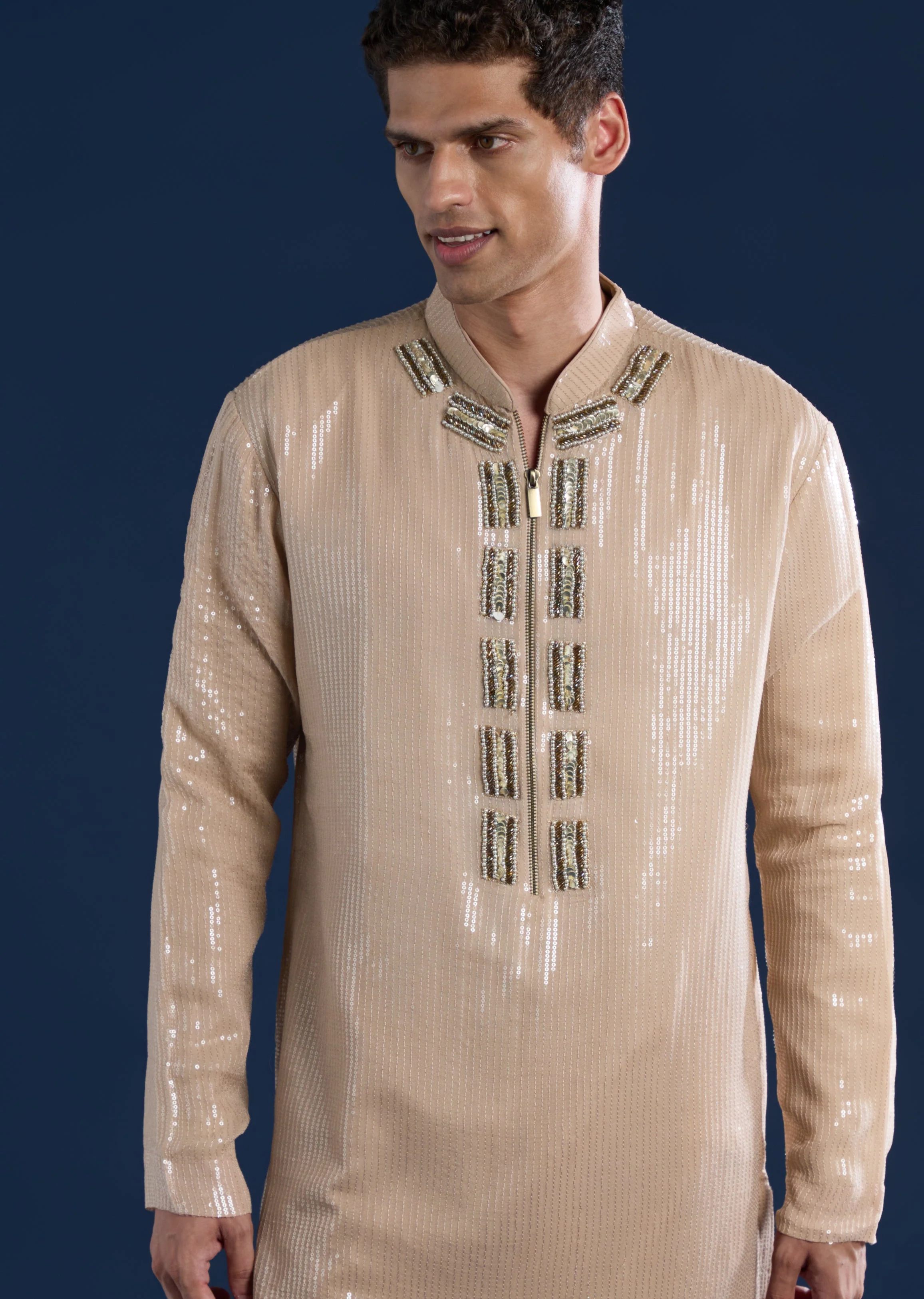 Grand Celebration Couple Set – Gold Ready-Pleated Satin Saree with Stone Detailing for Her And Beige Embroidered Kurta Jacket Set for Him - Image 6
