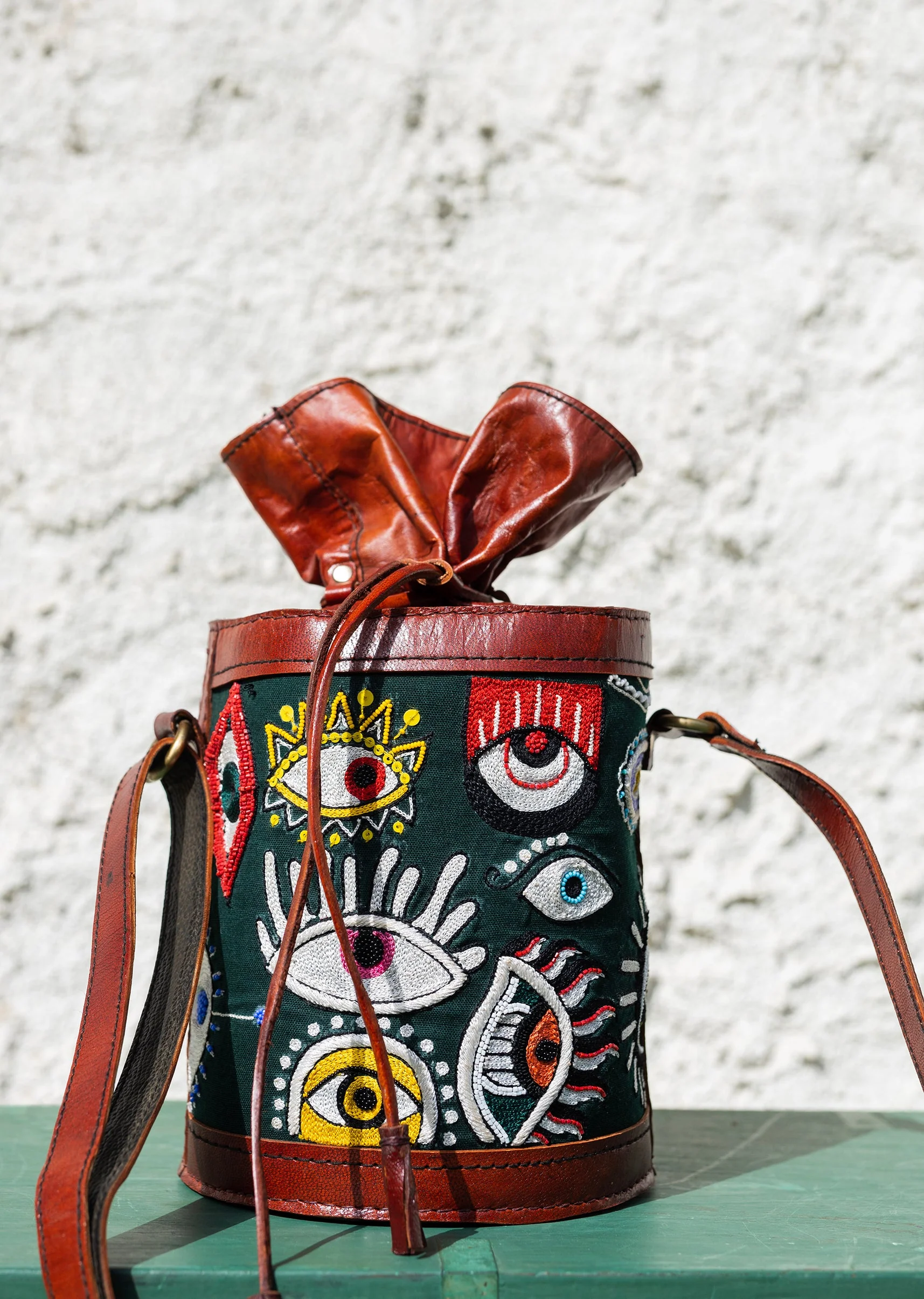 Handcrafted leather potli bag with bold colourful eye embroidery - Image 3