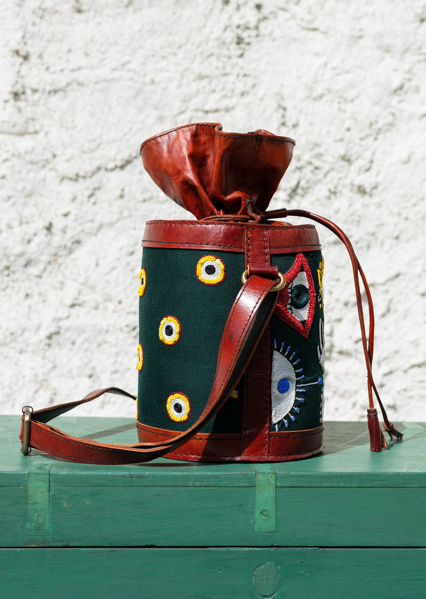 Handcrafted leather potli bag with bold colourful eye embroidery - Image 5