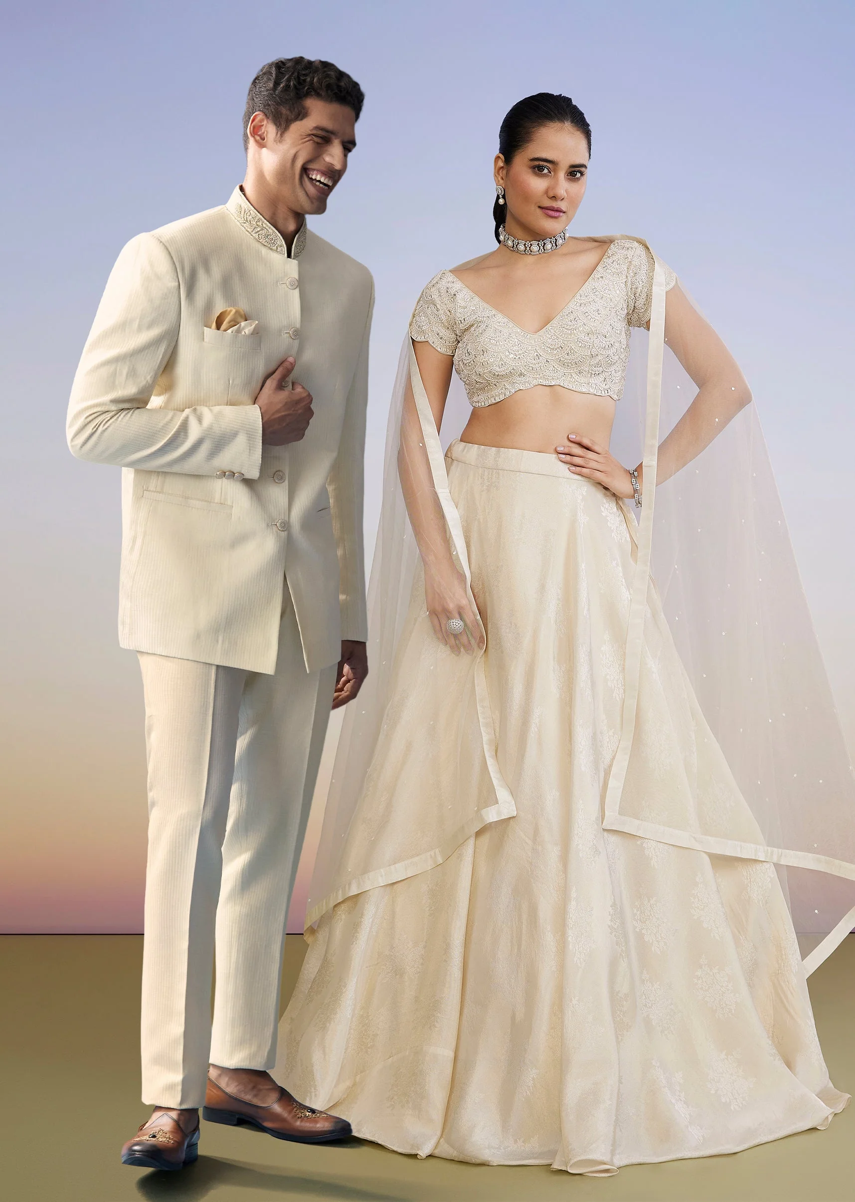 Ivory Regal Duo – Embroidered Lehenga For Her And Jacquard Jodhpuri Suit For Him