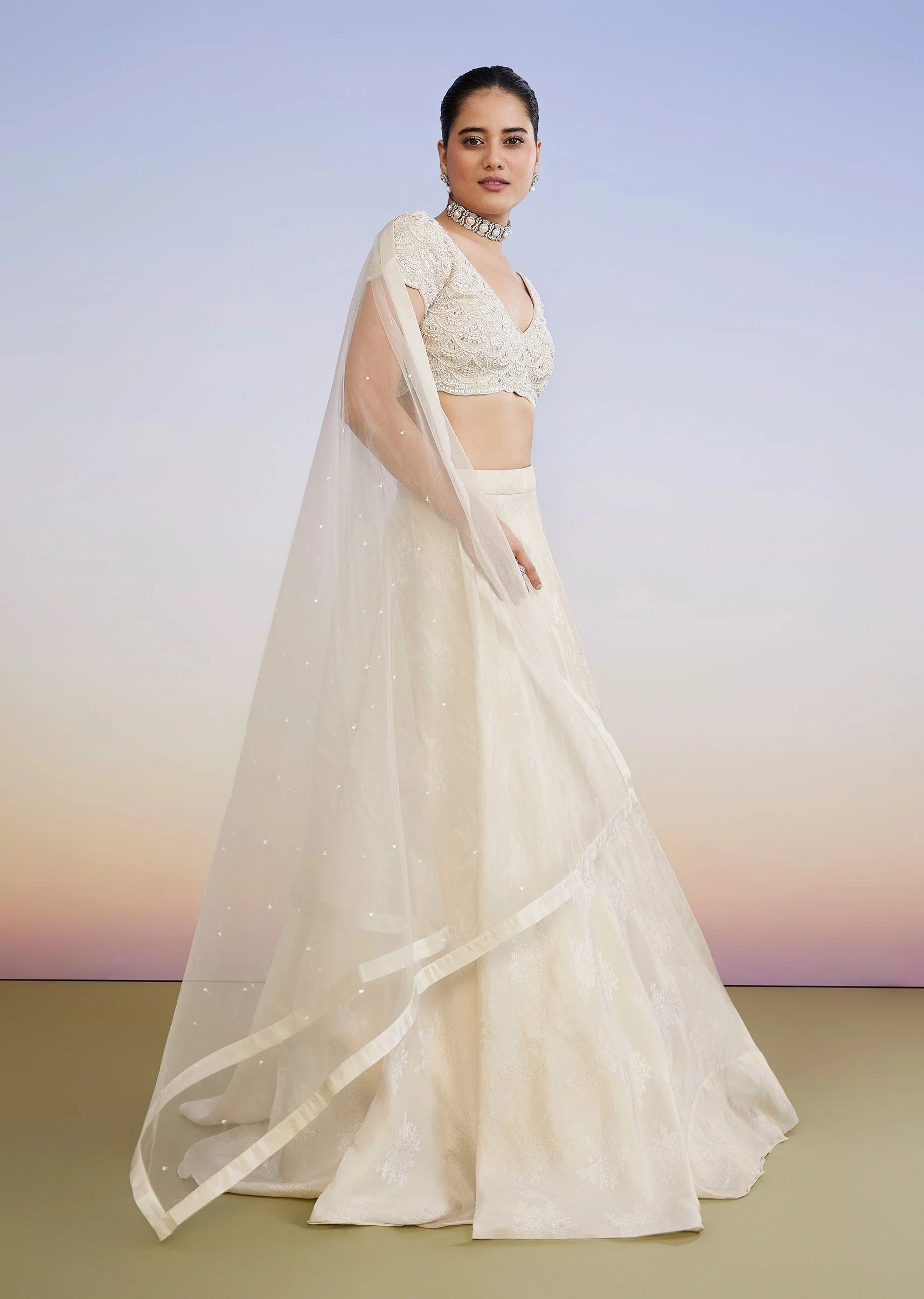 Ivory Regal Duo – Embroidered Lehenga For Her And Jacquard Jodhpuri Suit For Him - Image 4