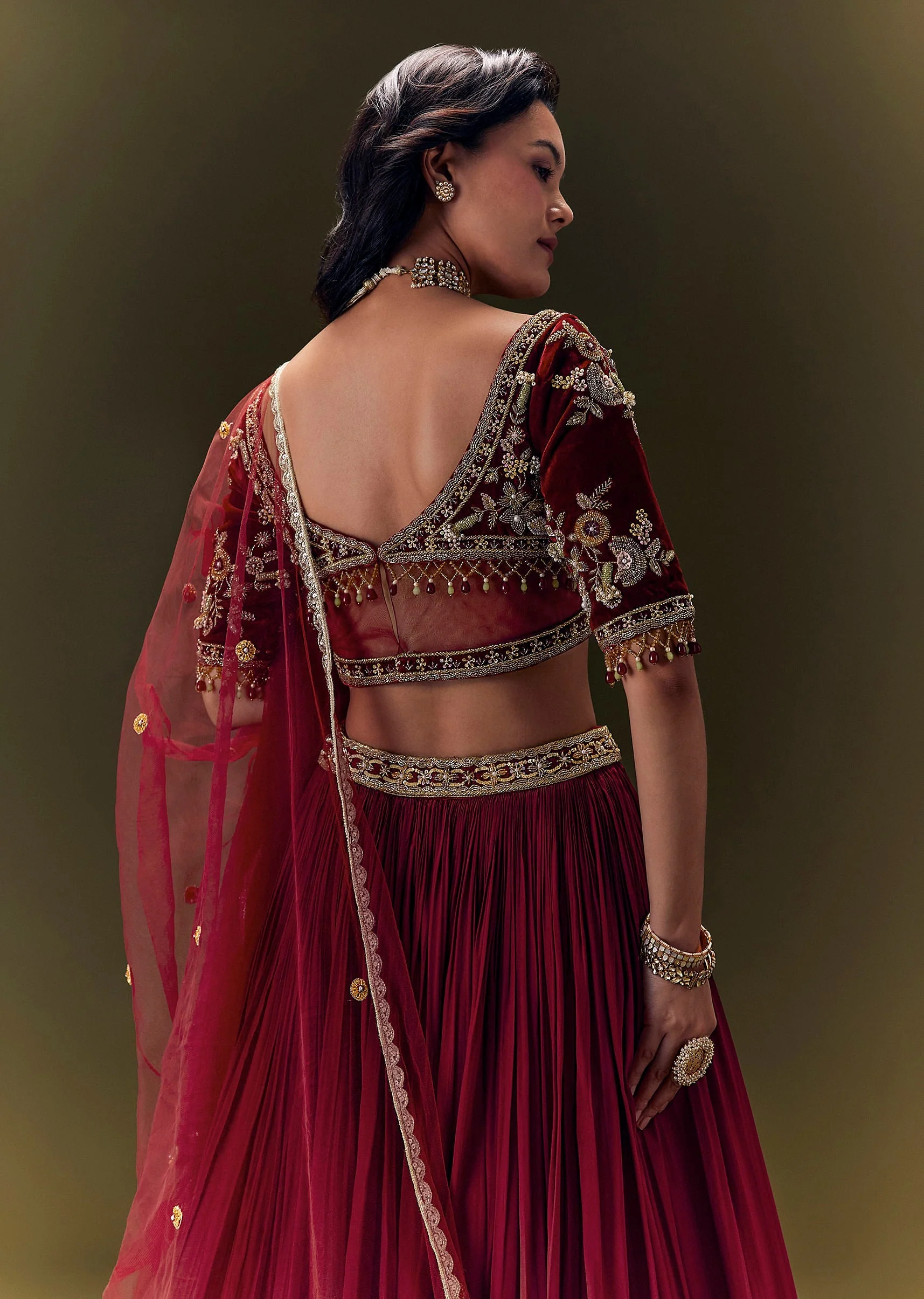 Maroon Pleated Skirt With Hand Embroidered Velvet Belt And Blouse With Net Dupatta - Image 4