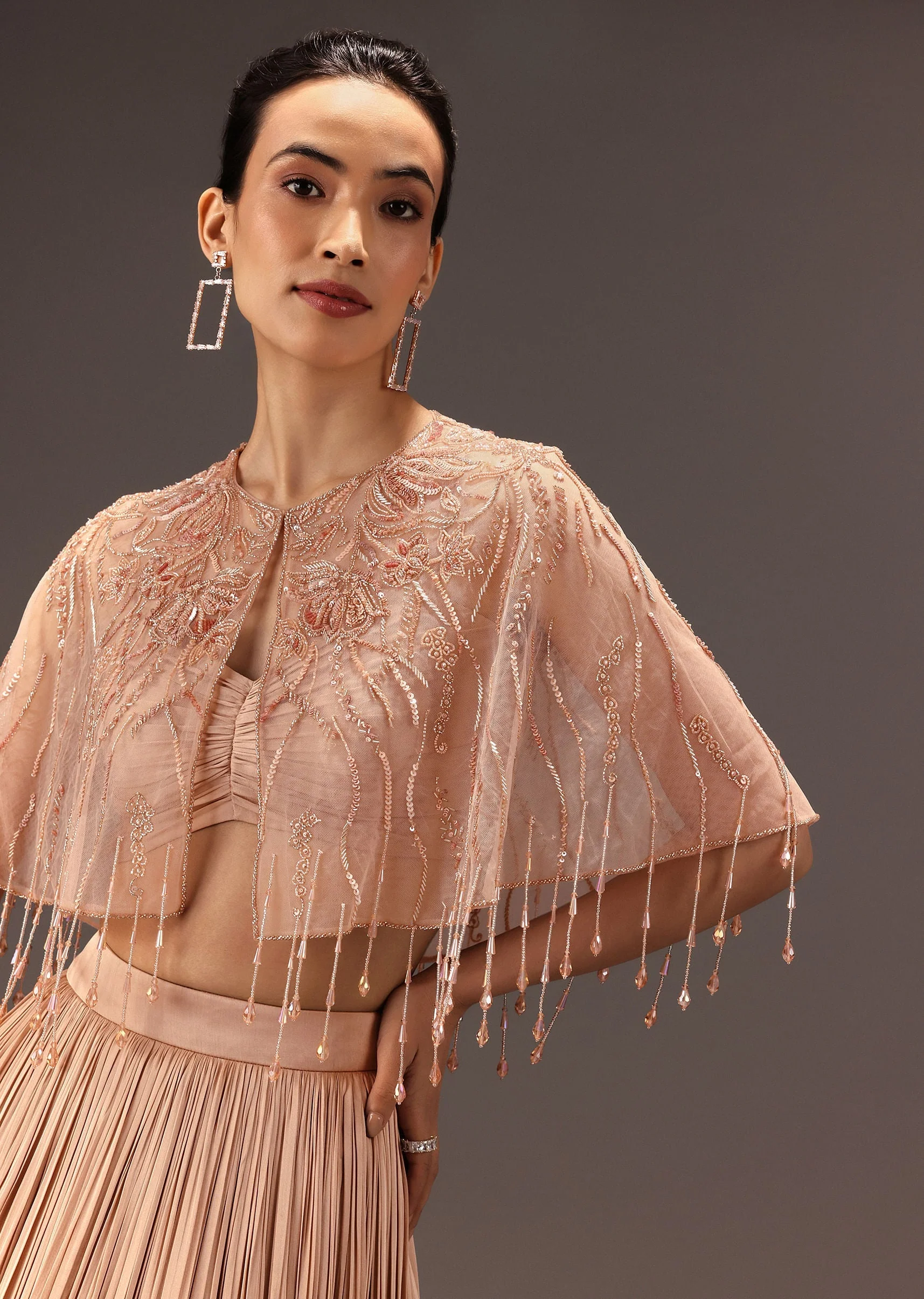 nude Ruched Blouse With Cape And Layered Skirt - Image 5
