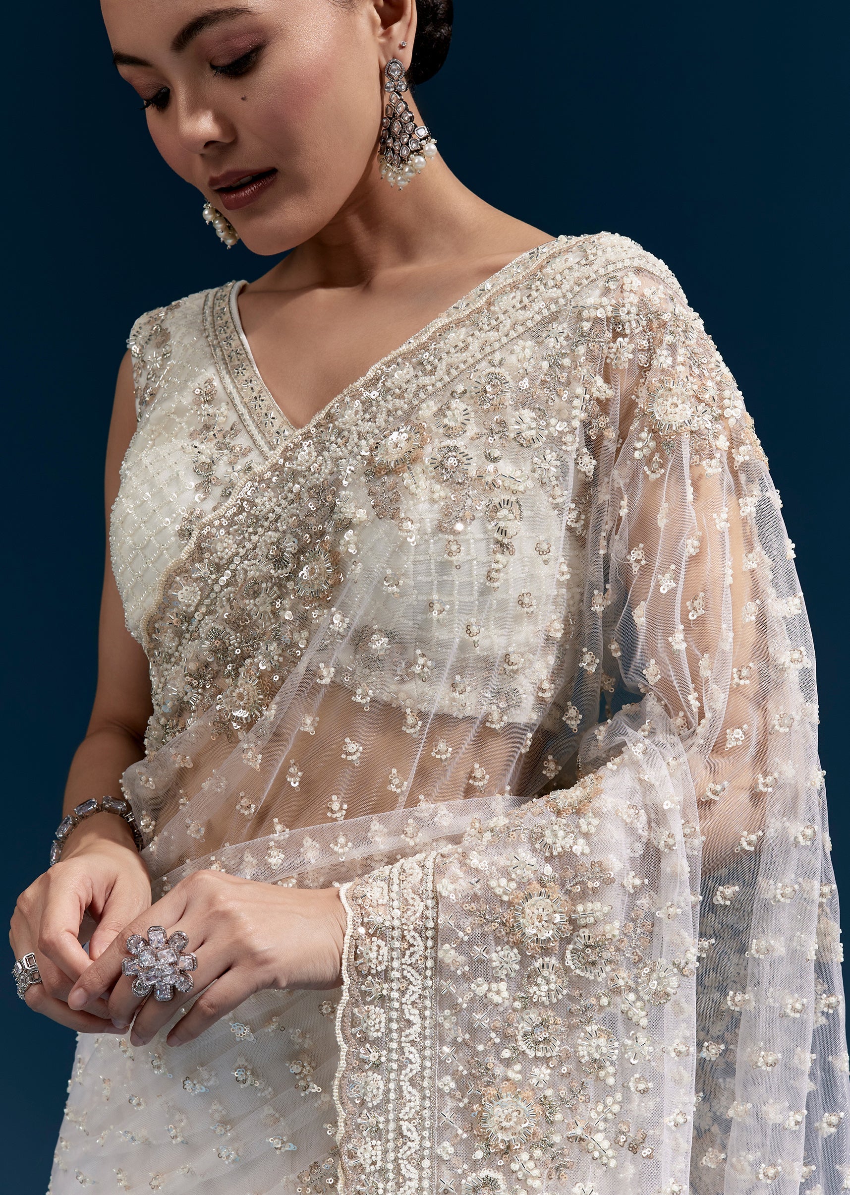 Off White Heavy Embroidered Net Saree With Scalloped Border And Tasselled Pallu - Image 2