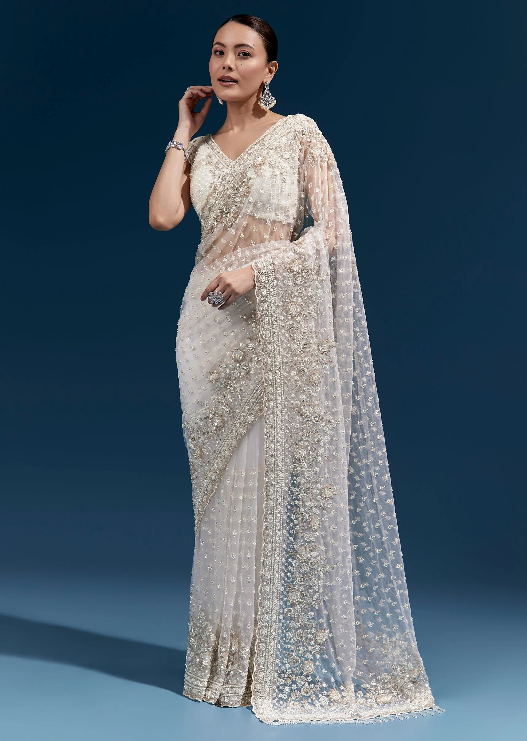 Off White Heavy Embroidered Net Saree With Scalloped Border And Tasselled Pallu - Image 3