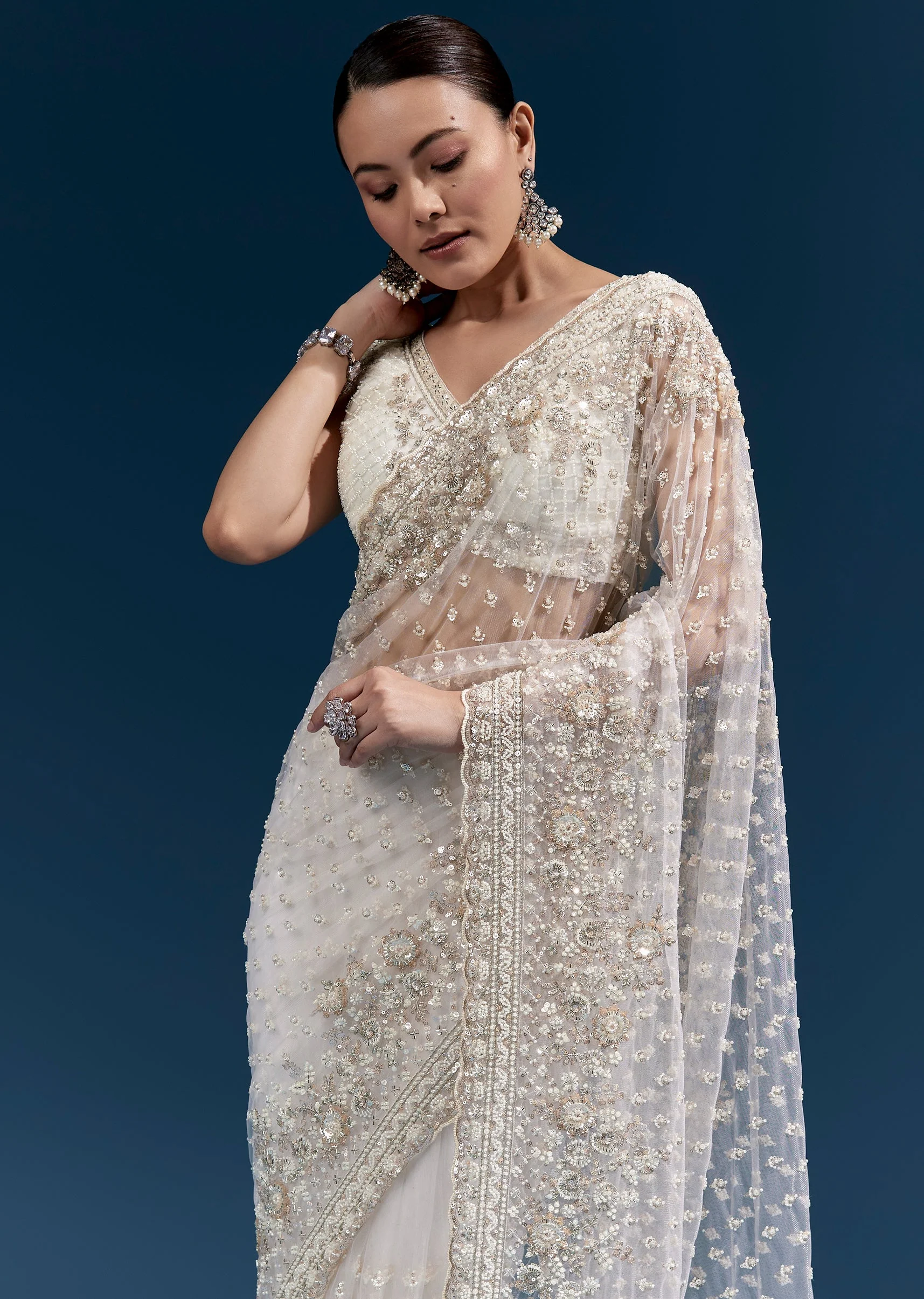 Off White Heavy Embroidered Net Saree With Scalloped Border And Tasselled Pallu - Image 5
