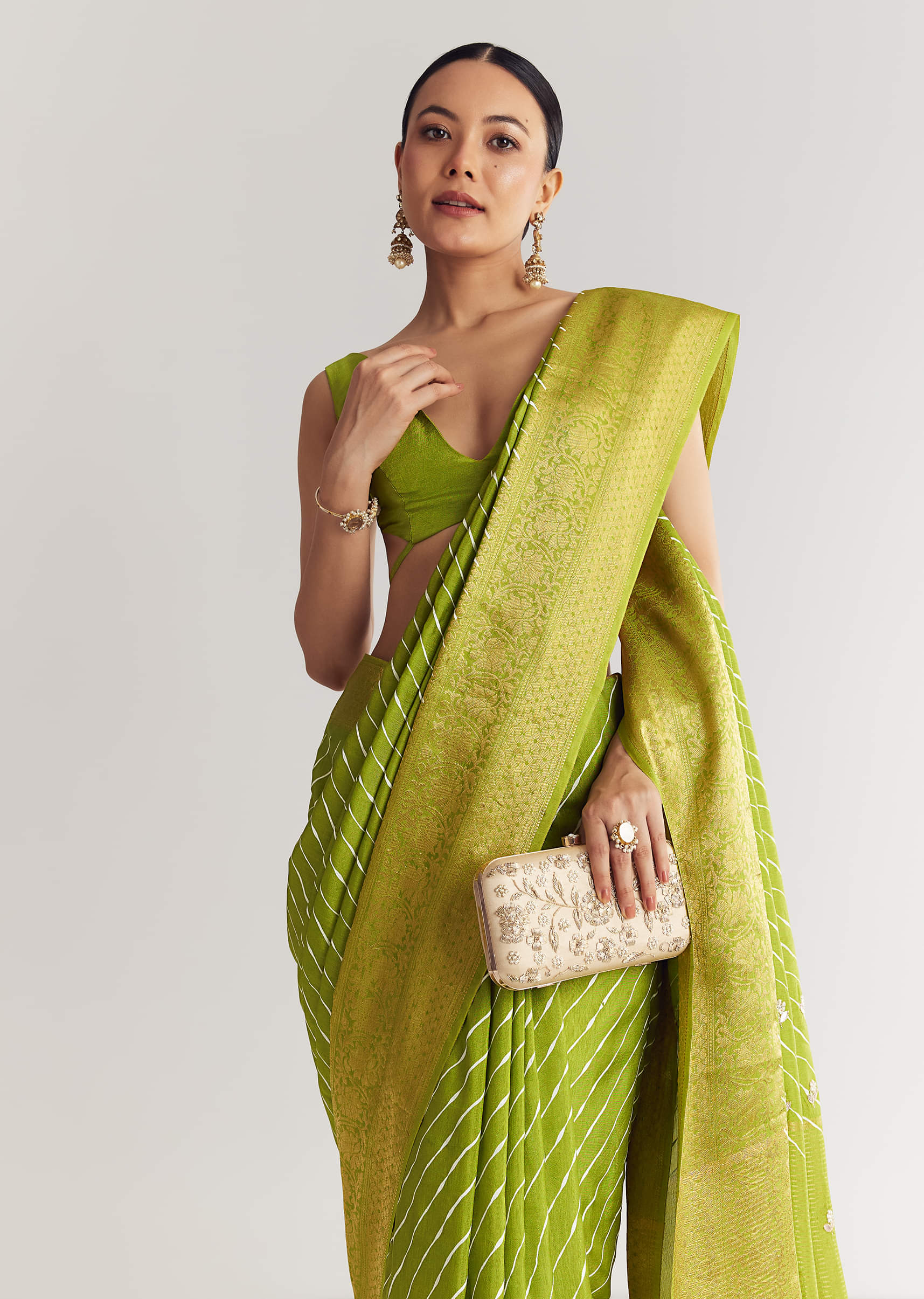 Pista Green Saree With Lehariya Print And Floral Gotapatti And Moti Work.