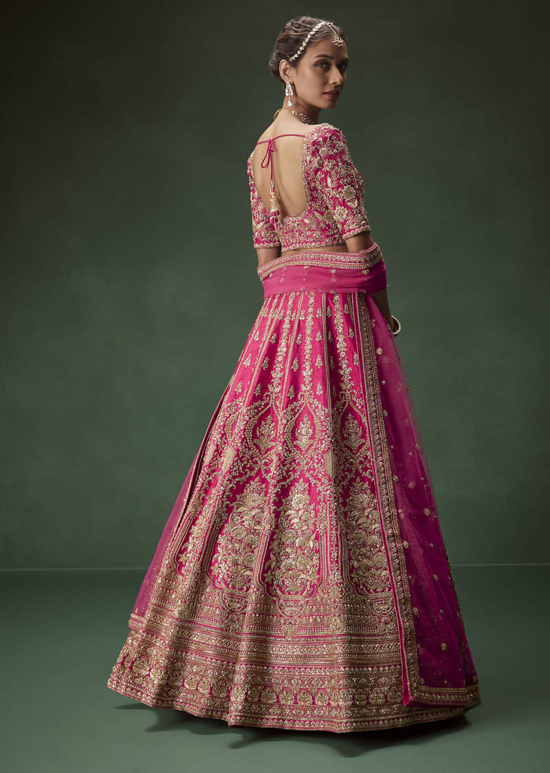 Rani Pink Bridal Lehenga With Gold Zari And Rich Embroidery - Image 2