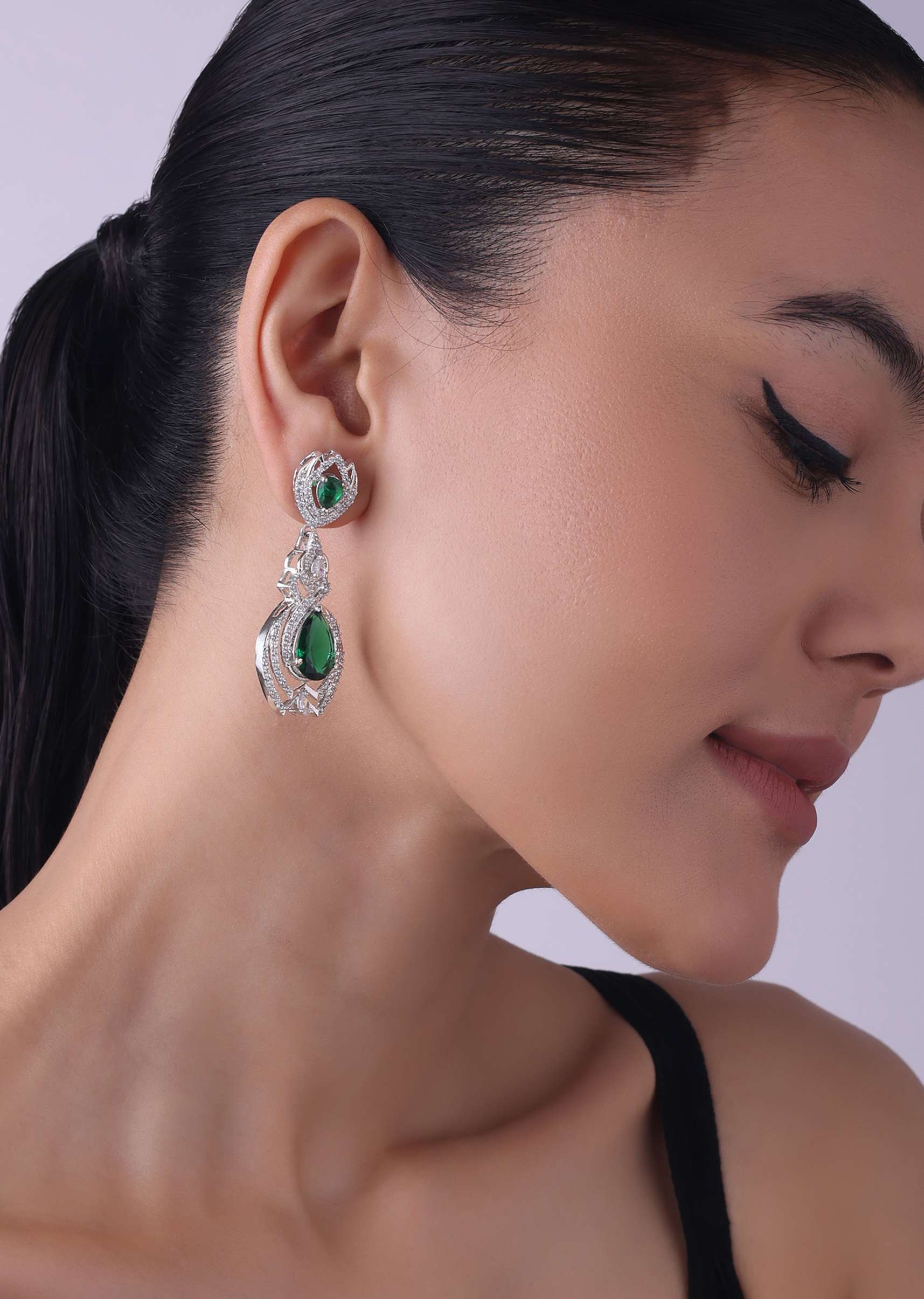Silver Finish Danglers Studded With Faux Emerald Stones