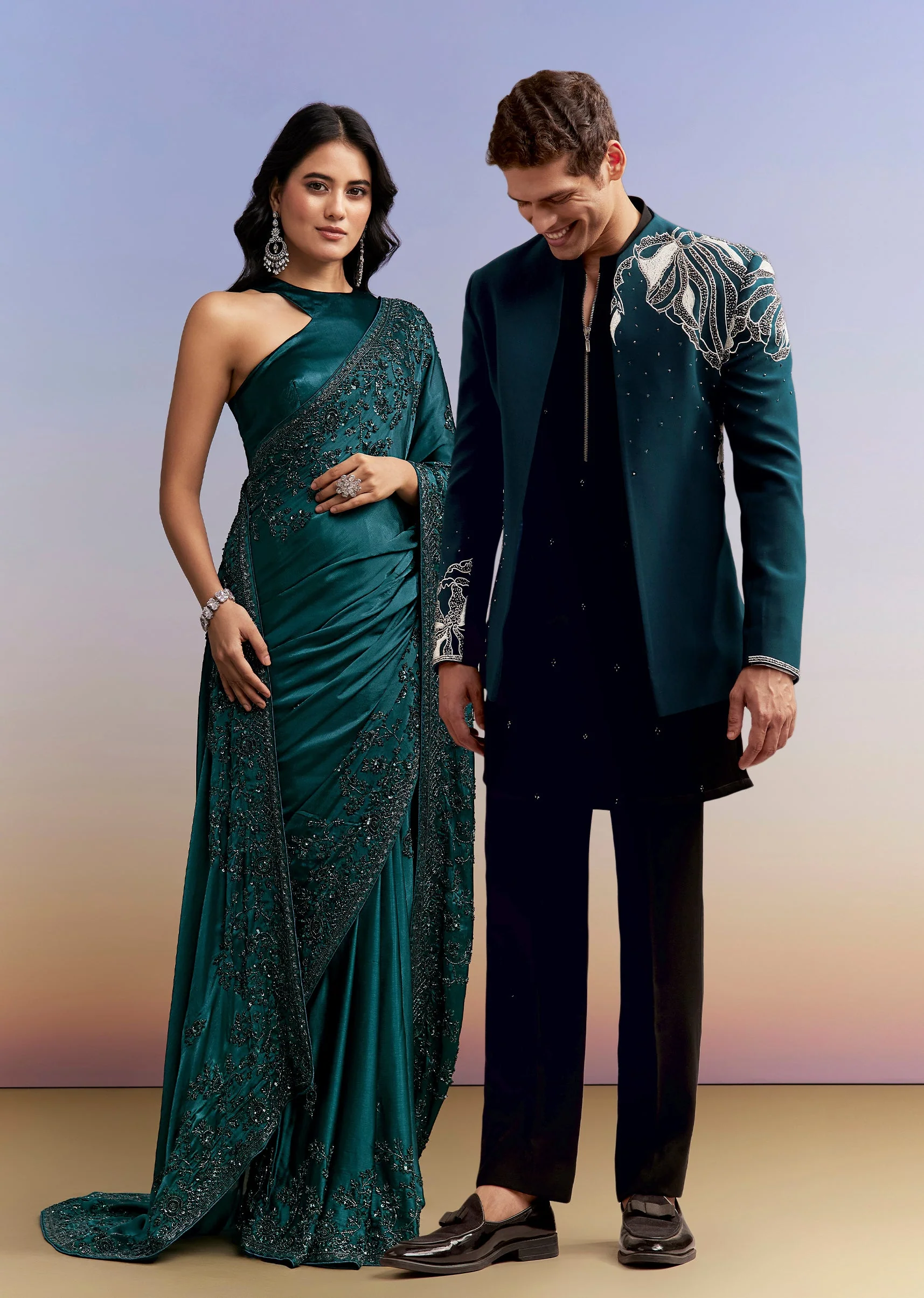 Statement Evening Couple Set – Teal Blue Satin Chinon Saree With Heavy Hand Embroidery For Her And Teal Blue Indo-Western Set With Heavy Embroidery For Him