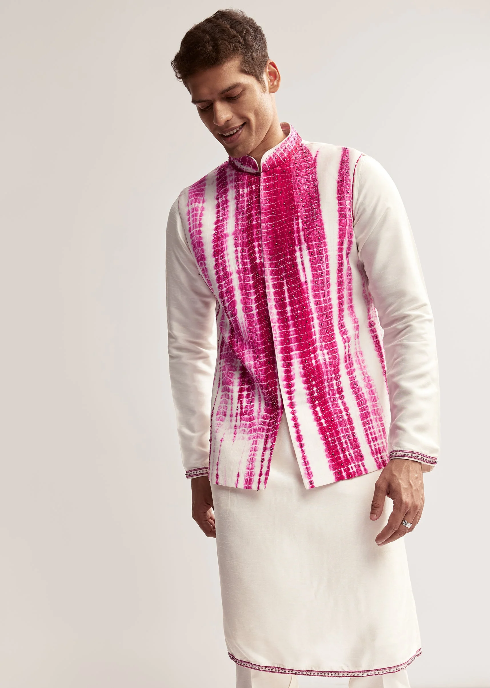 Vibrant Bandhani Festive Couple Set – Bandhani Cape Skirt Set For Her And Pink Silk Tie-Dye Kurta Jacket Set For Him - Image 9