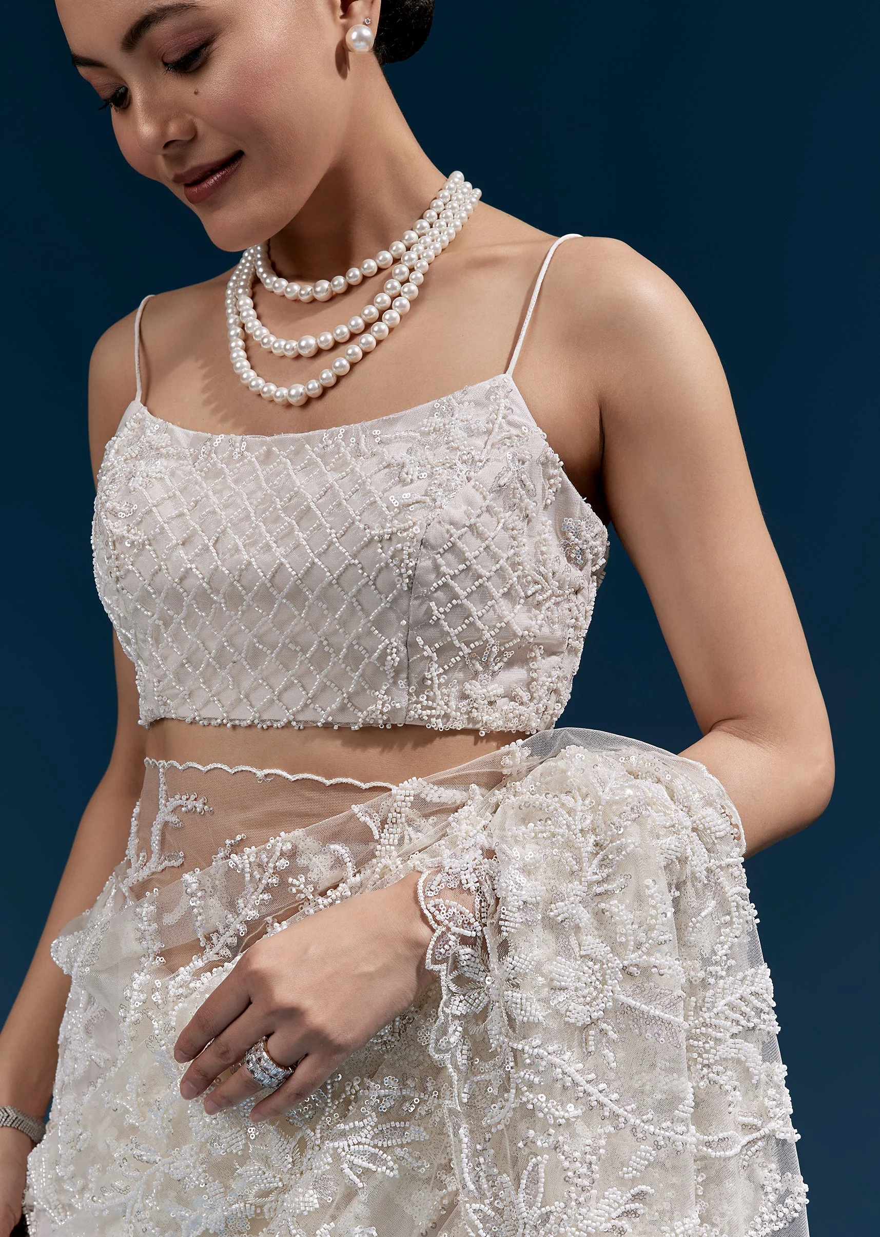White Heavy Embroidered Net Saree With All Over Floral Jaal And Cutwork Border - Image 2
