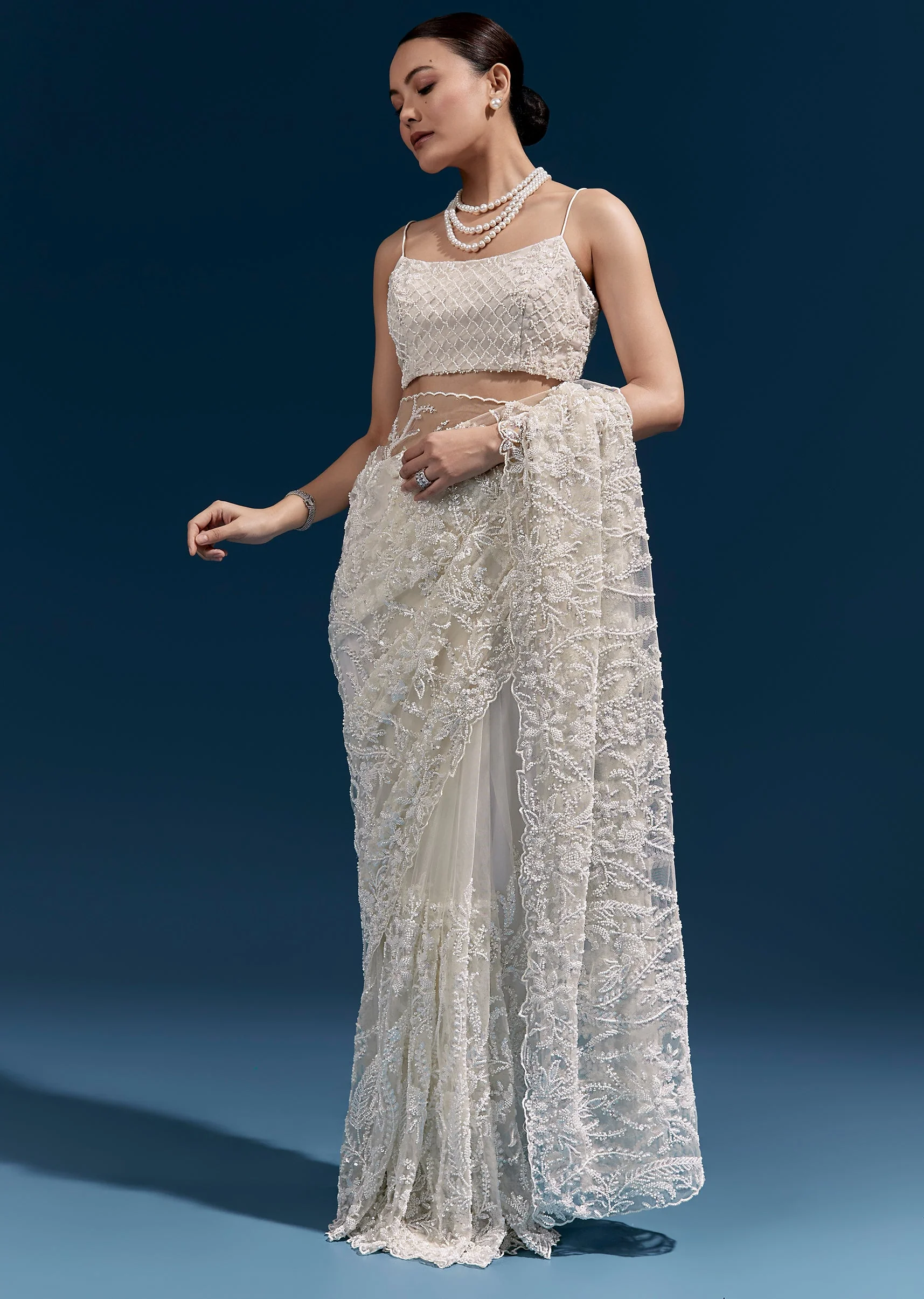 White Heavy Embroidered Net Saree With All Over Floral Jaal And Cutwork Border - Image 3