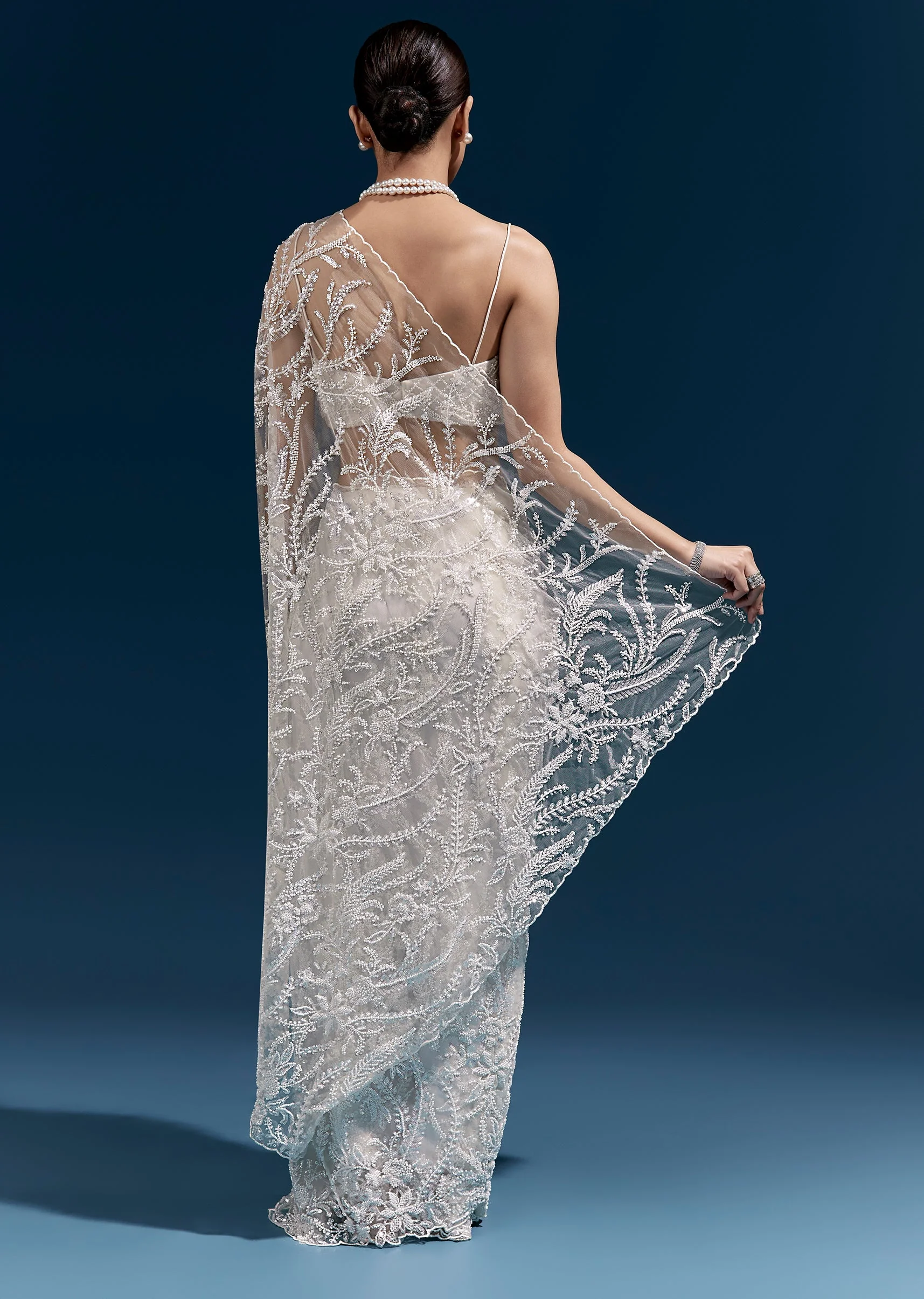 White Heavy Embroidered Net Saree With All Over Floral Jaal And Cutwork Border - Image 4